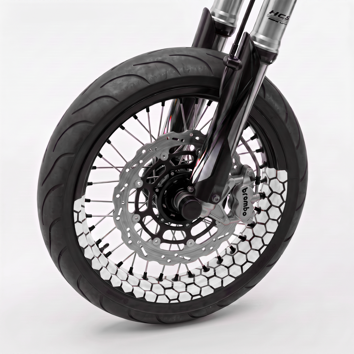 Llanta de moto con vinilo de panal hexagonal blanco en el perfil de la rueda